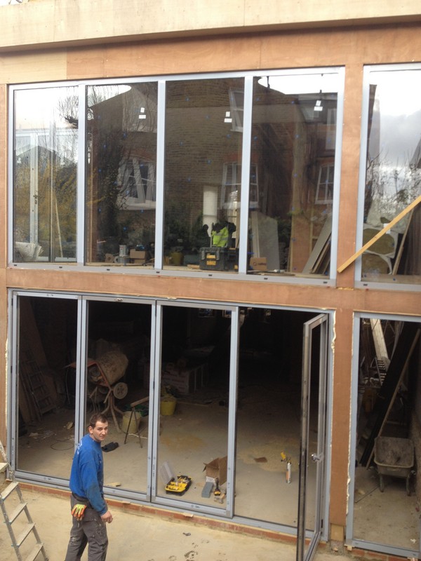 Aluminium bi-fold doors with two-storey glazing in Chiswick