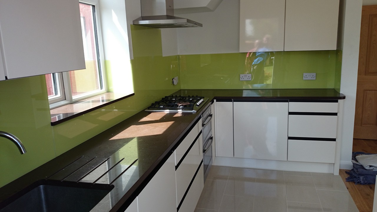 Lime green glass kitchen splashback installed by Chiswick glaziers
