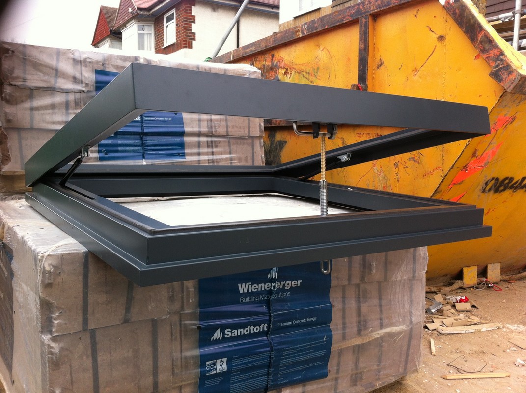 Opening flat roof skylight in anthracite grey installed in Chiswick